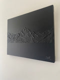 Textured mountain painting. All black. 